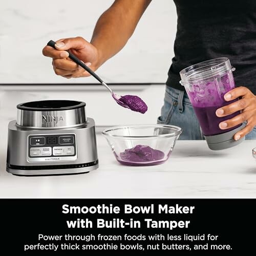 Person using a smoothie bowl maker with built-in tamper